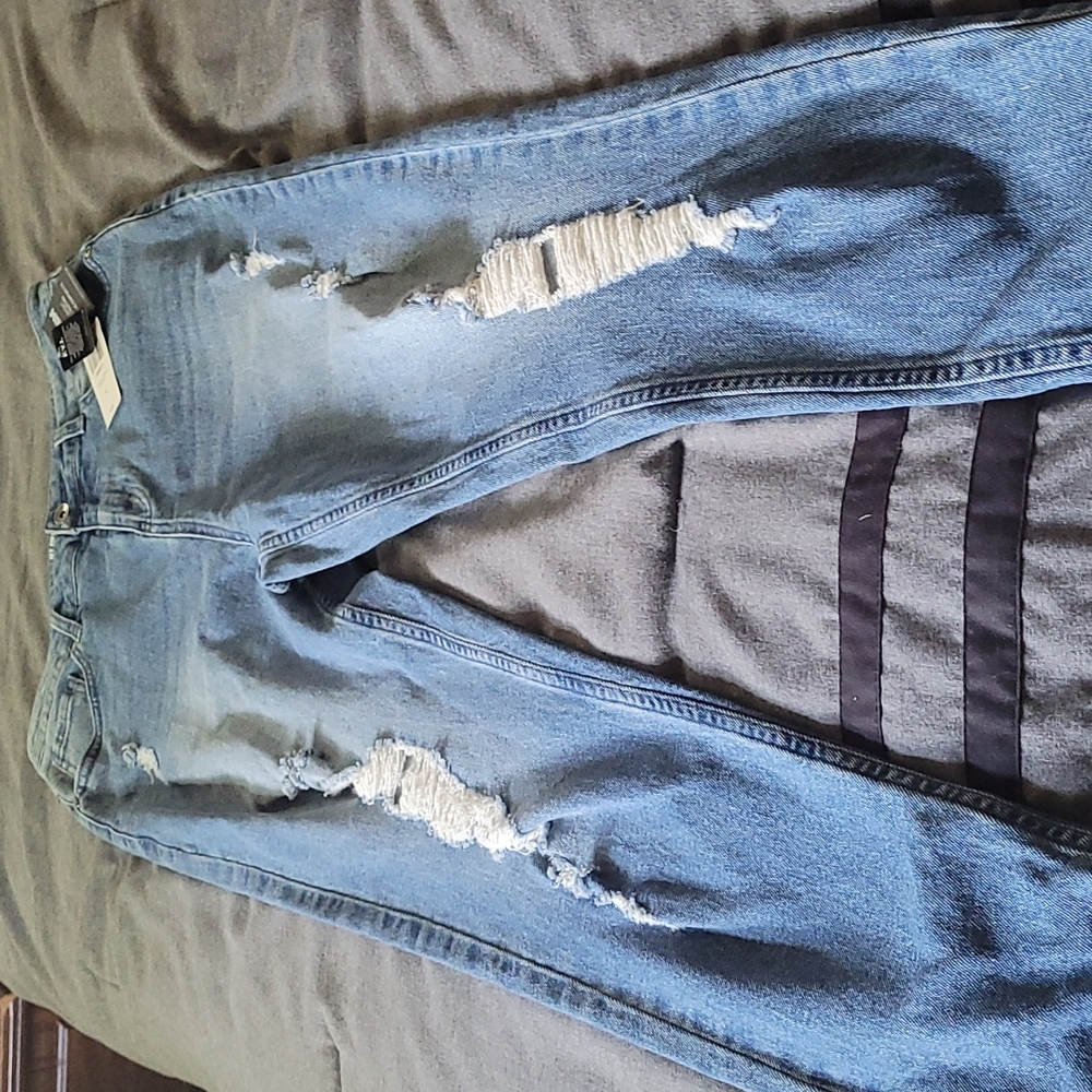 NWT Women's Hot Topic mom jeans.  Medium wash.  Some destruction.  Size 9